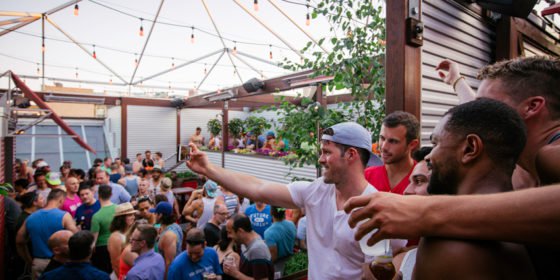 Party-goers convene at Sidetrack bar’s outdoor patio