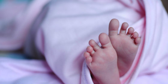 Baby's feet, same-sex couple gives birth to triplets