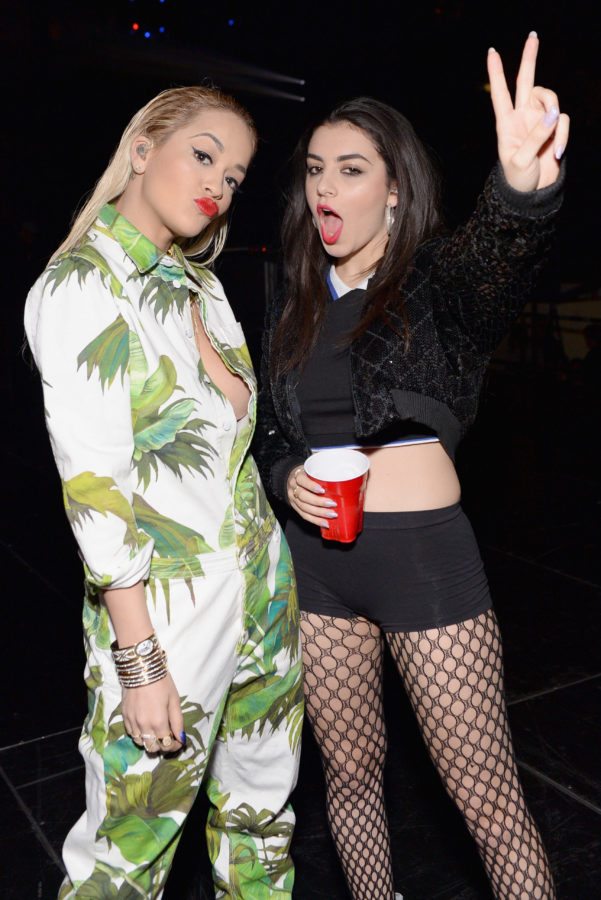 CHICAGO, IL - DECEMBER 18: Singers Rita Ora (L) and Charli XCX attend 103.5 KISS FM's Jingle Ball 2014 at Allstate Arena on December 18, 2014 in Chicago, Illinois. (Photo by Daniel Boczarski/Getty Images for iHeartMedia)