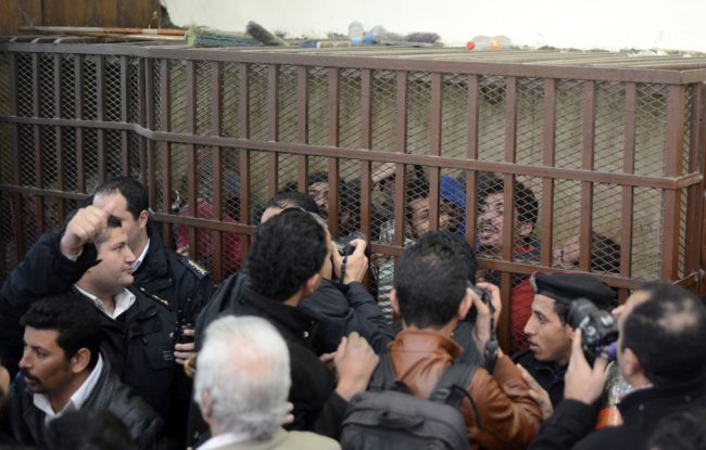 Defendants react behind the bars at a court in Cairo following the acquittal on January 12, 2015 of 26 male men accused of "debauchery" after they were arrested in a night-time raid on a bathhouse in the Egyptian capital last month that triggered international concern. The men were arrested on December 7 in the raid on a hammam in the Azbakeya district of Cairo, amid fears of a widening police crackdown on homosexuals in Egypt even though Egyptian law does not expressly ban homosexuality. AFP PHOTO / MOHAMED EL-SHAHED (Photo credit should read MOHAMED EL-SHAHED/AFP/Getty Images)