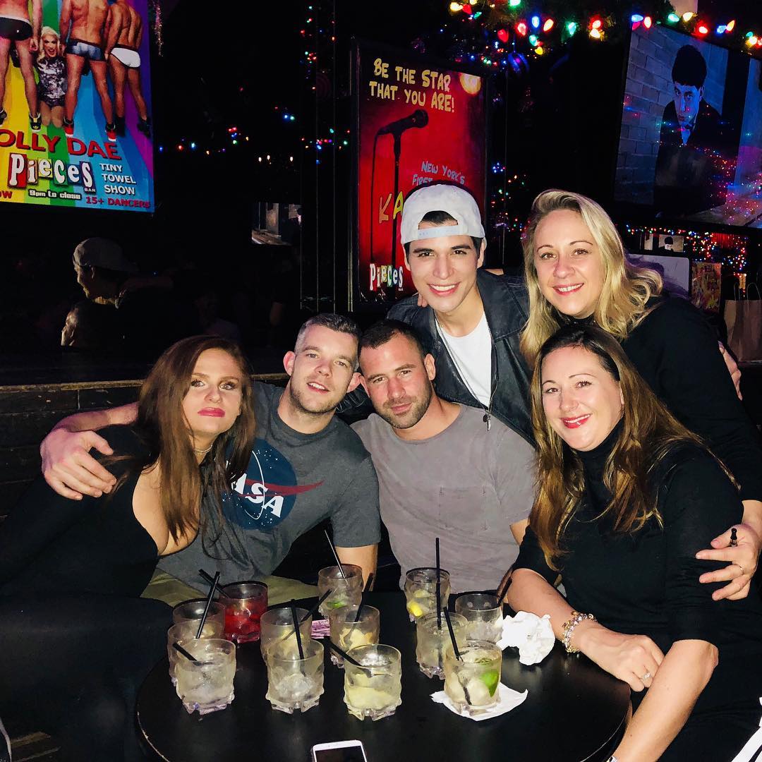 The couple and friends at a bar.