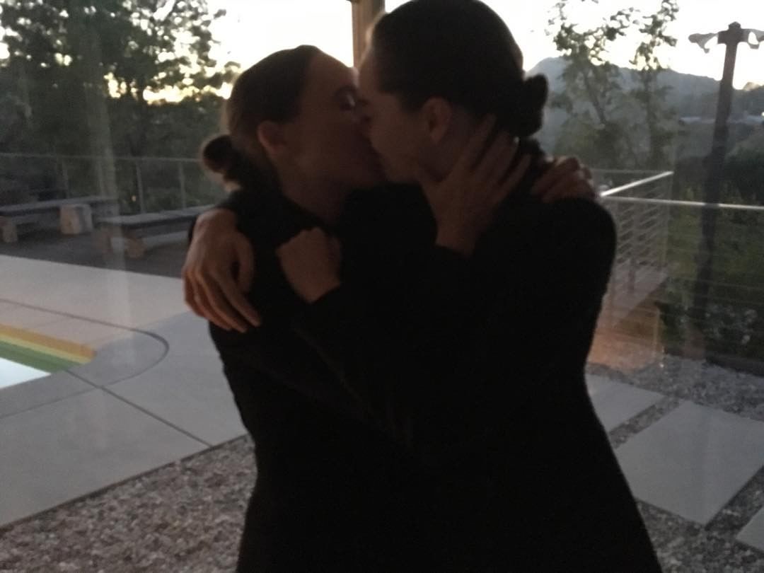Ellen Page and Emma Portner sharing a kiss.