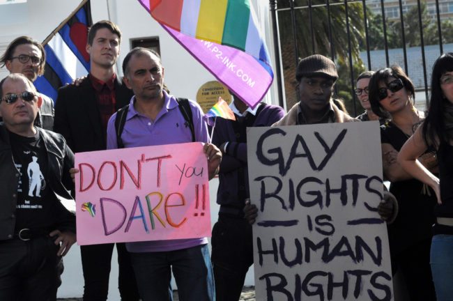 A group of people from the gay, lesbian and transgender community in South Africa demonstrate outside the Parliament in Cape Town, on May 19, 2012. The protesters gathered to oppose the proposal by the House of Traditional Leaders to remove the term "sexual orientation" from section 9 (3) of the South African Constitution, which prohibits unfair discrimination. AFP PHOTO / RODGER BOSCH (Photo credit should read RODGER BOSCH/AFP/GettyImages)