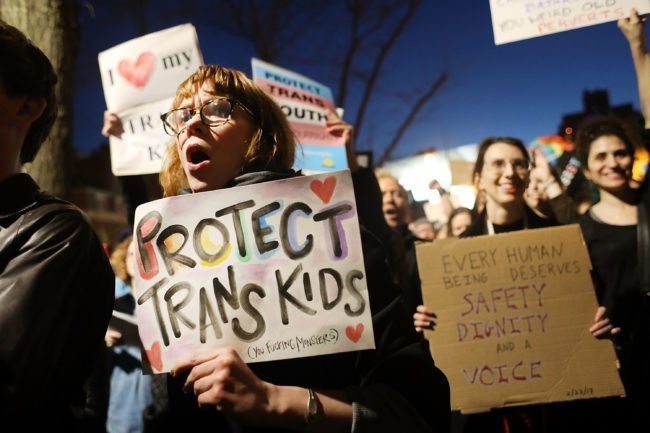 NEW YORK, NY - FEBRUARY 23: Hundreds protest a Trump administration announcement this week that rescinds an Obama-era order allowing transgender students to use school bathrooms matching their gender identities, at the Stonewall Inn on February 23, 2017 in New York City. Activists and members of the transgender community gathered outside the historic LGTB bar to denounce the new policy. (Photo by Spencer Platt/Getty Images)