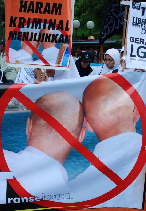 Indonesian Muslim protestors of Muslim organization 'Hizbuth Tahrir' hold a banner reading, 'Forbidden, Crime and Disgusting' refering to Lesbian, Gay, Bisexual and Transexual associations during a protest against an eventual meeting on the issue in Surabaya on March 26, 2010. Indonesian police said on March 24, they will not issue a permit for an international gay and transgender group to convene a regional conference because of fears it could incite unrest. The international lesbian, gay, bisexual, transgender and intersex association (ILGA) was scheduled to meet from 26 - 28 March in the world's most populous Muslim country. AFP PHOTO / MUHAMMAD RISYAL HIDAYAT (Photo credit should read MUHAMMAD RISYAL HIDAYAT/AFP/Getty Images)