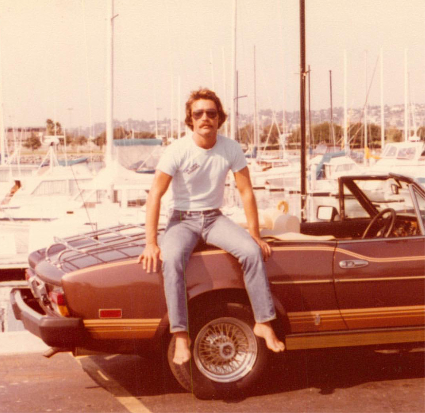 A man sits on a car in San Diego, 1979