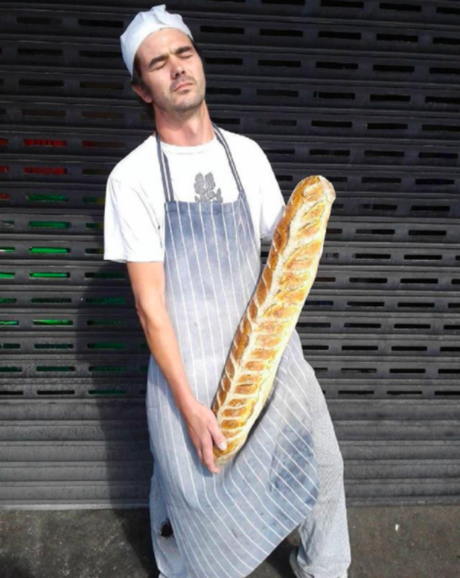 A man with a big baguette