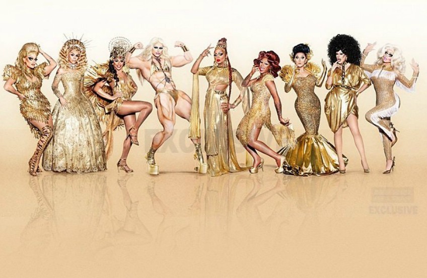 The cast of RuPaul's Drag Race All Stars 3 standing in a row all wearing gold clothes