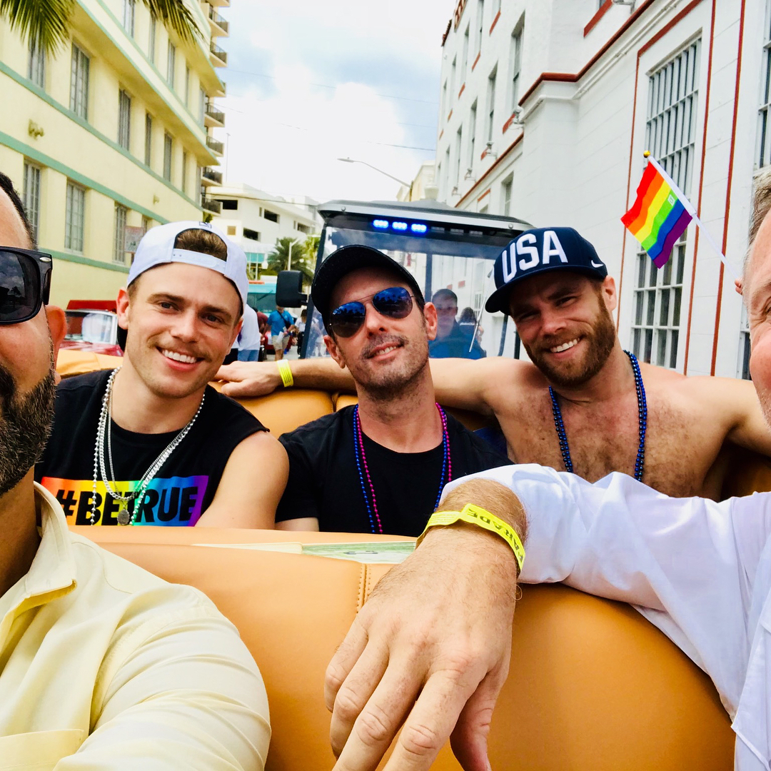 Gus riding in the Miami Beach Gay Pride parade as the Grand Marshall | Photo: @lag305