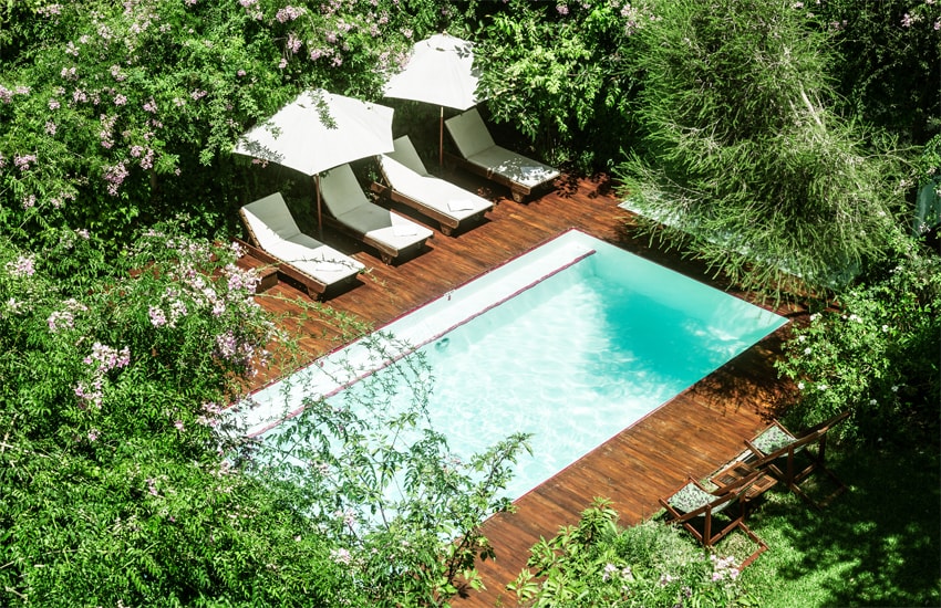 The swimming pool in the enchanting Home Hotel garden 