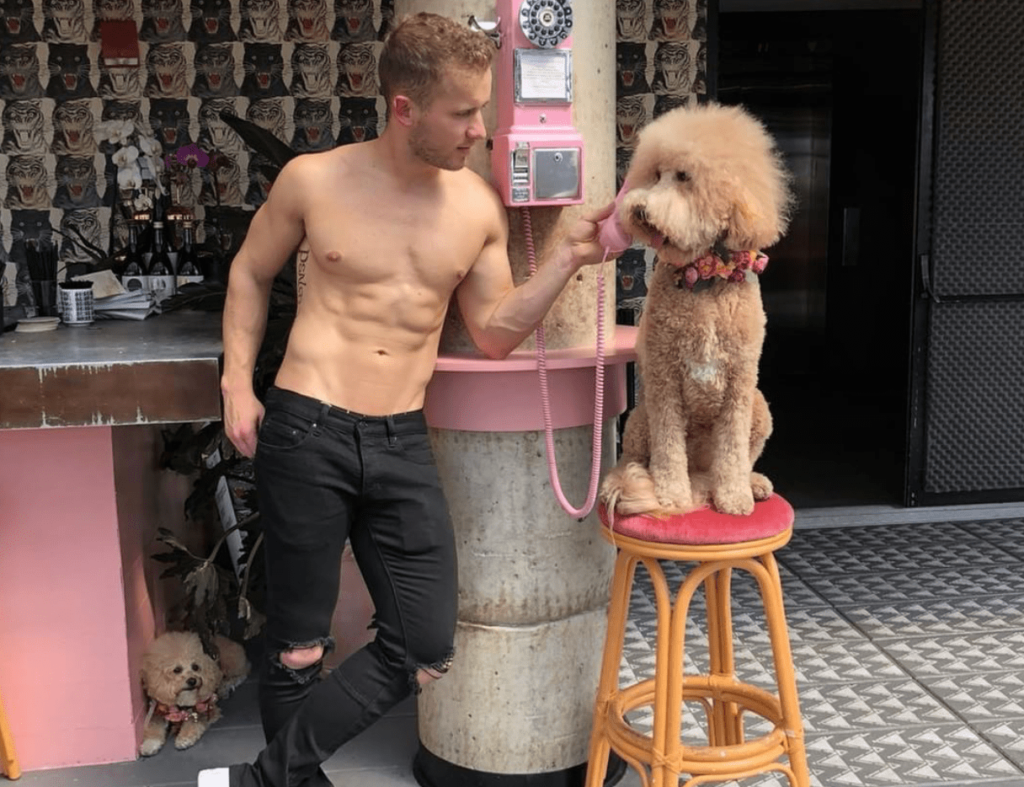 'Oh, it's for you' | Photo: Provided to Gay Star News by @HotDudesWithDogs Instagram