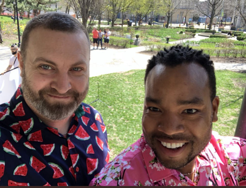 Two men in floral print shirts