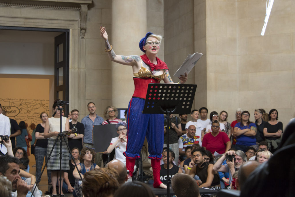 An artist performing at Tate Britain during Queer and Now festival