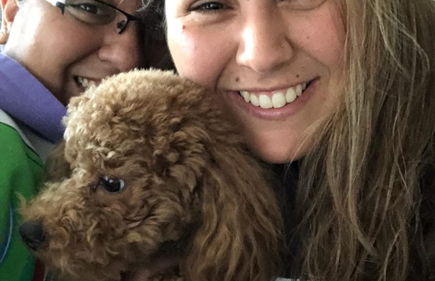 Laura and girlfriend Brandy with one to the dogs they look after at Barks and Leashes | Photo: Supplied / Laura Vargas