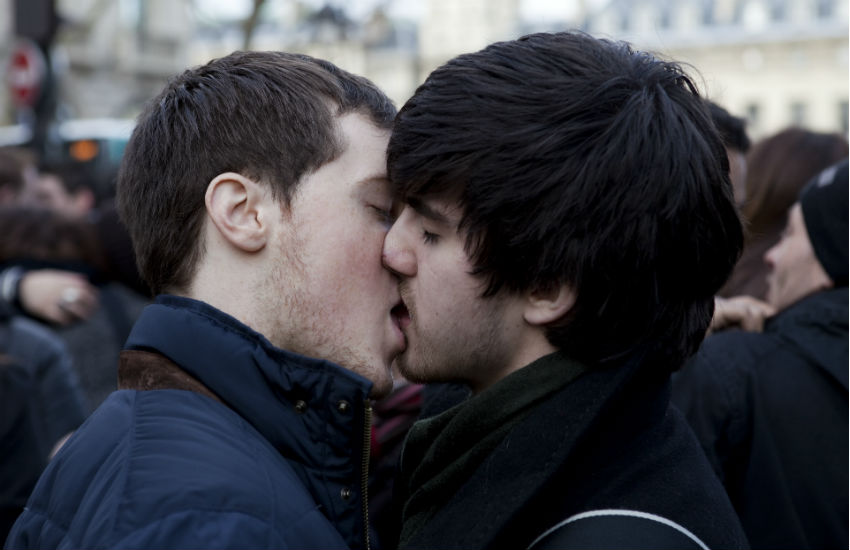 Gay couple kiss at Pride