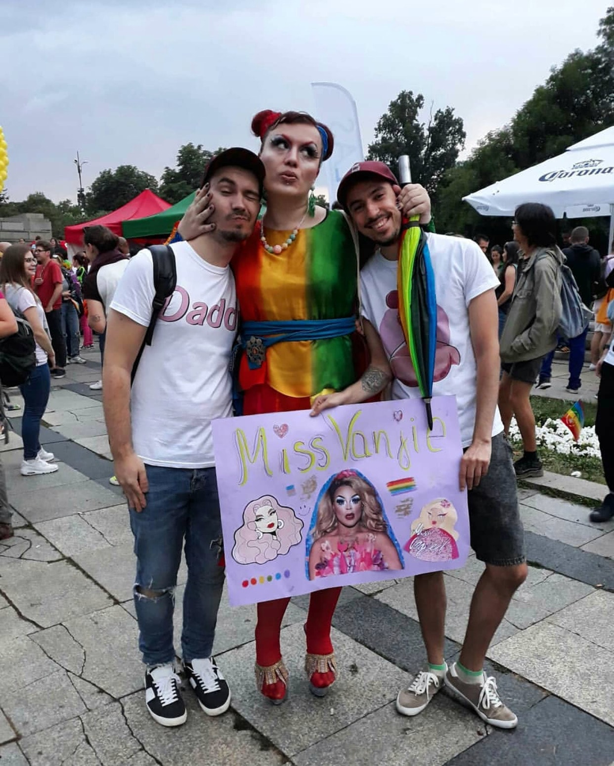 Two men posing with a drag queen at Sofia Pride.