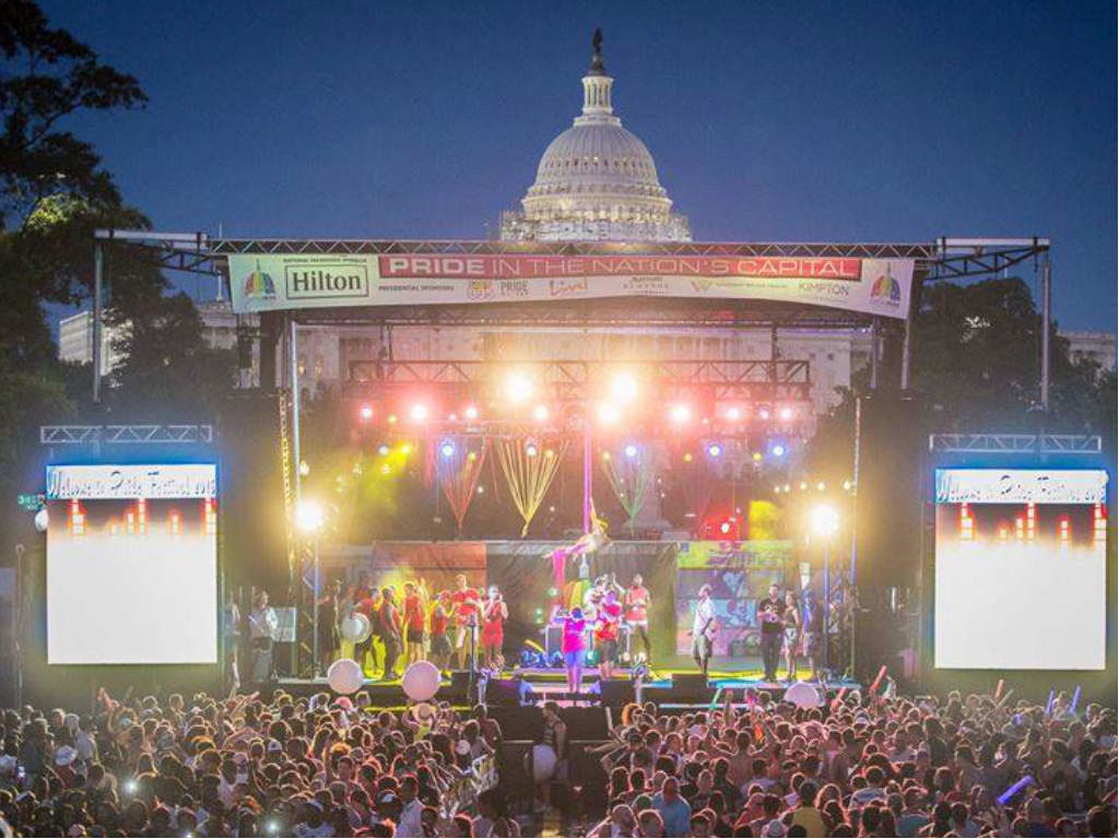 Crowd at the annual Capital Pride Concert in DC, with US Capitol in the background.