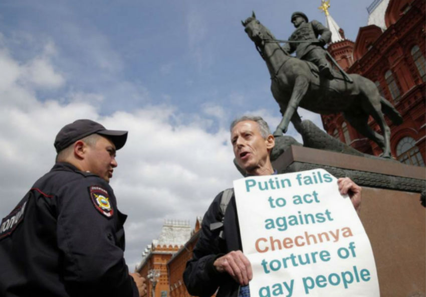 Peter Tatchell being questioned by police last week outside the Kremlin