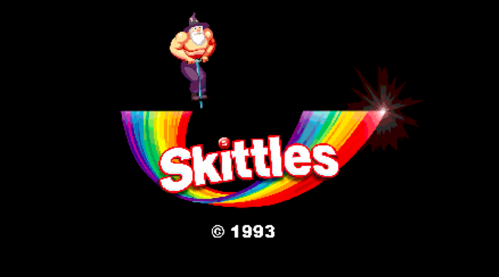 A screengrab of the Skittles video with the rainbow logo.