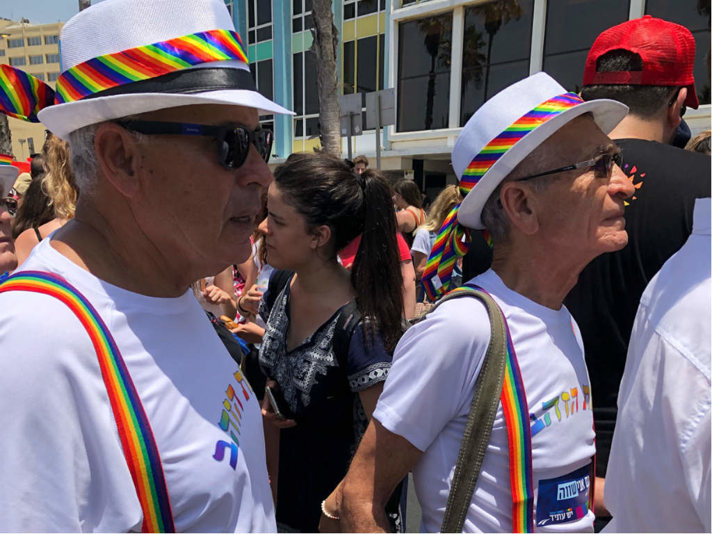 Two men in rainbow strap at Tel Aviv Pride