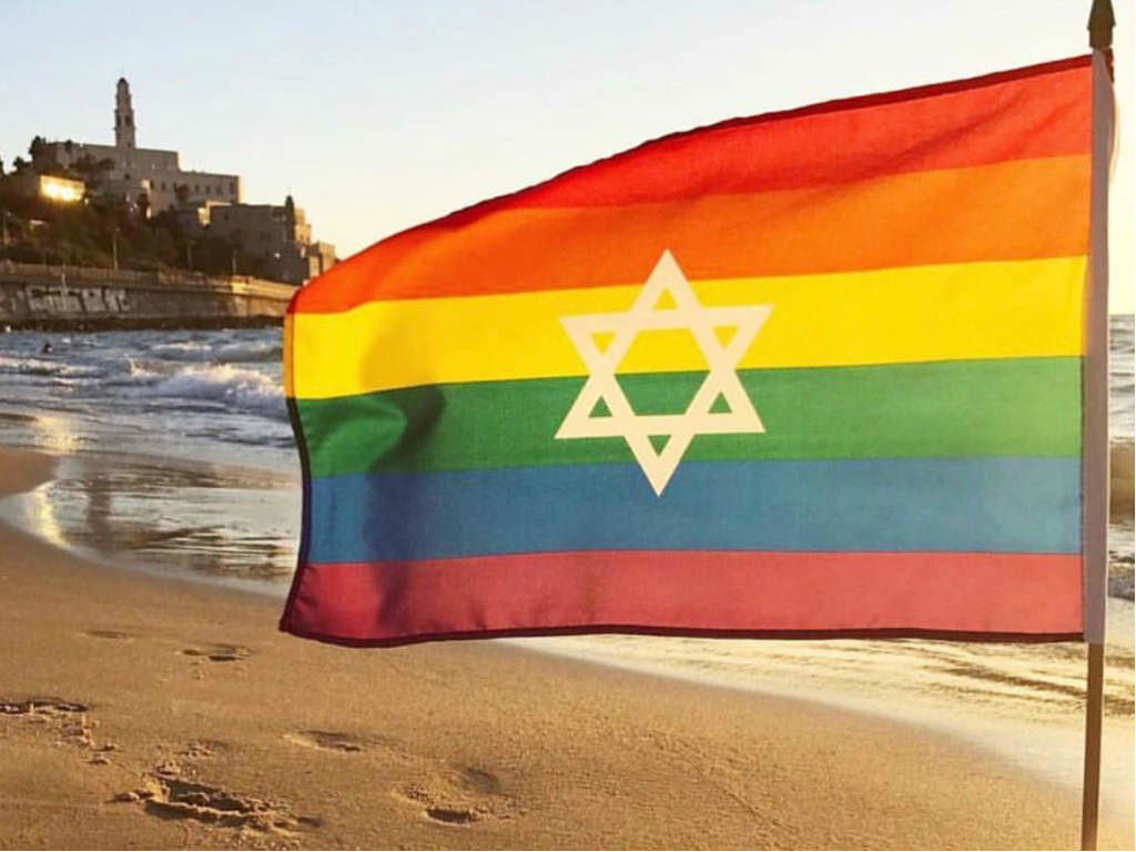 A rainbow flag waving at Thailand beach in Tel Aviv.