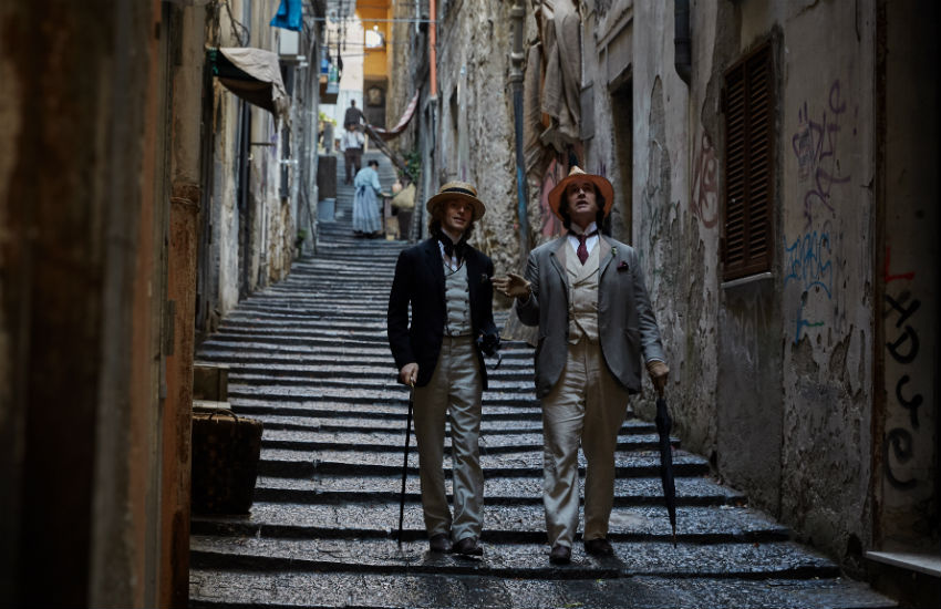 Douglas (Colin Morgan) and Wilde (Rupert Everett) take a stroll in Italy 