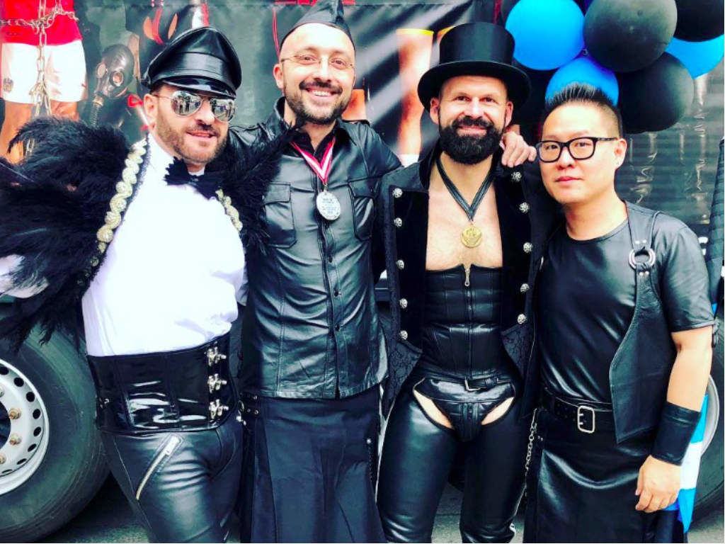 Four men in leather outfits at the parade