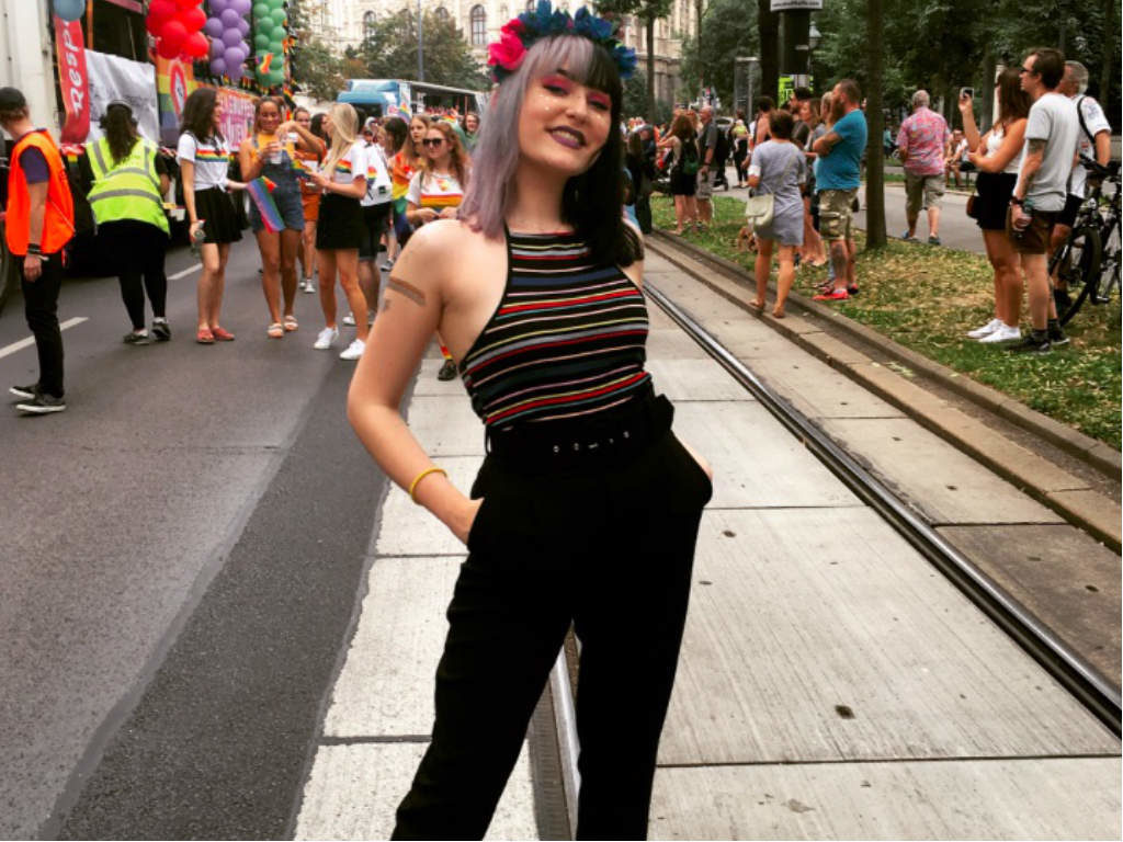 A girl wearing a flower wreath during the parade