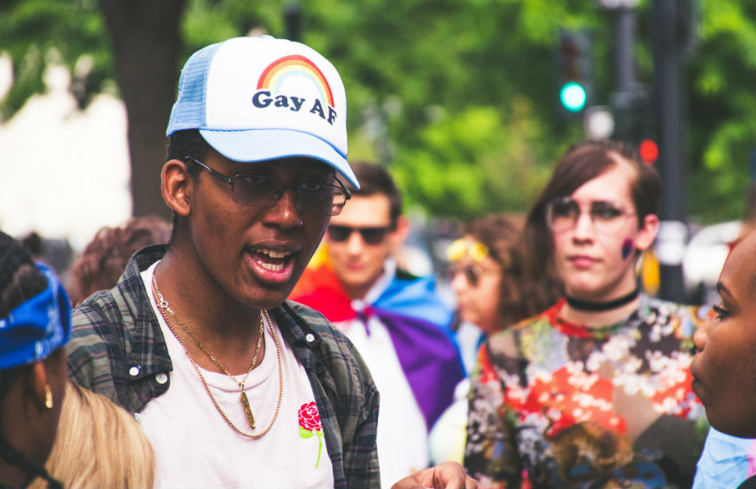 Man wearing a cap that says 'Gay AF'