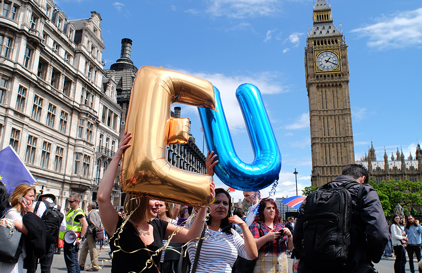 Anti-Brexit protestors hold up the letters EU outside the UK Parliament.