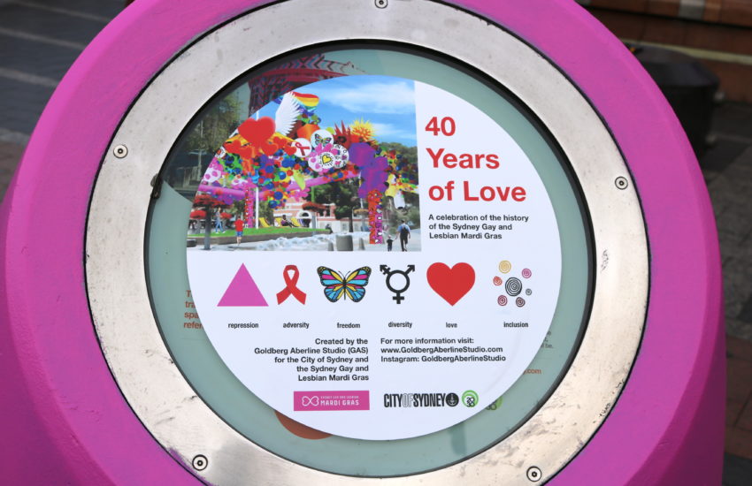 A plaque in front of the artwork that reads 40 years of love