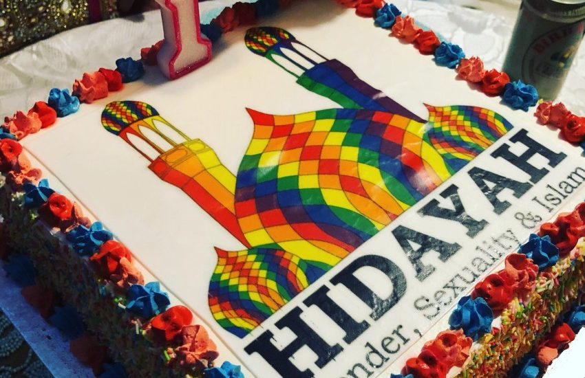 a close up of a cake, it has a rainbow mosque decorated on with the word Hidayah underneath it