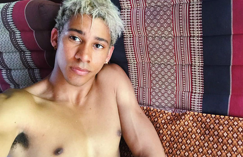 Queer actor Keiynan Lonsdale shirtless on a beach holiday