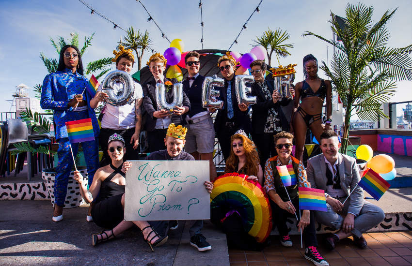 A group of prom attendees posing for a promo shots for Queer Prom