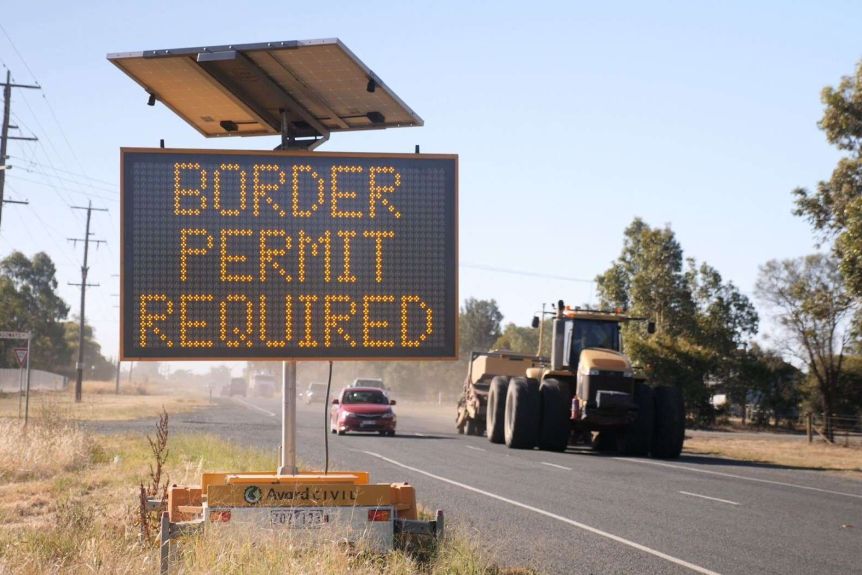 A roadside sign informs people to have a border permit to enter Victoria.