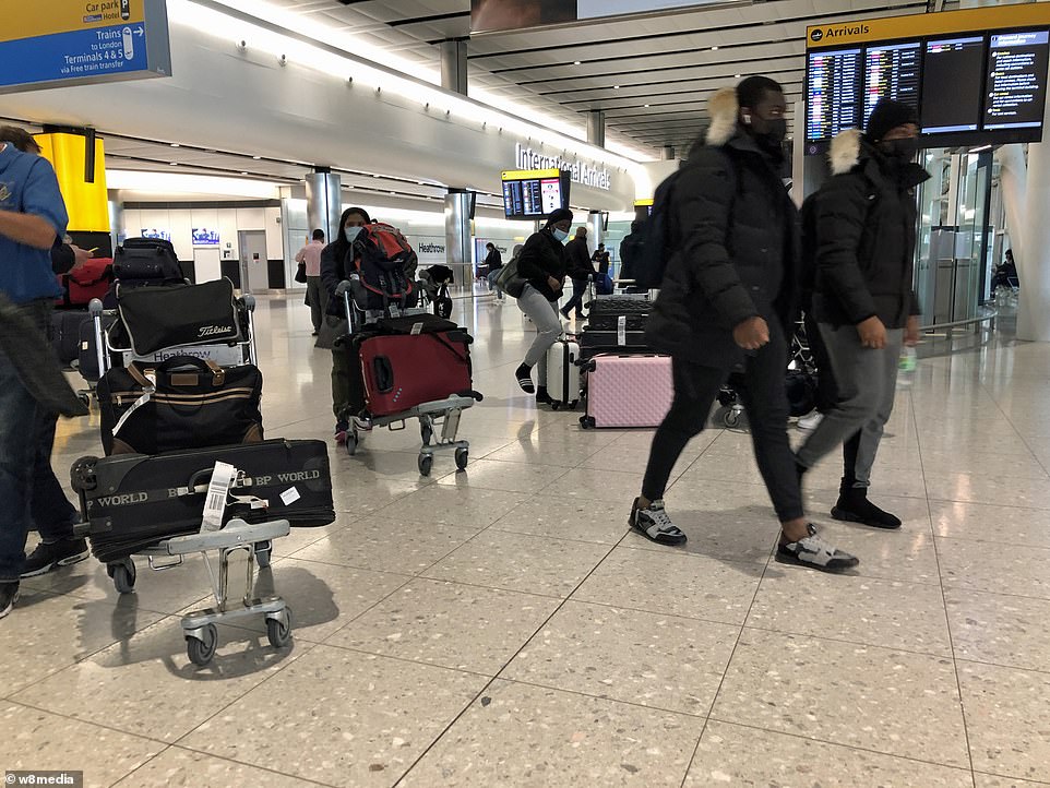 Passengers arrive at London Heathrow Airport this morning with the last few flights coming back to the UK from Dubai